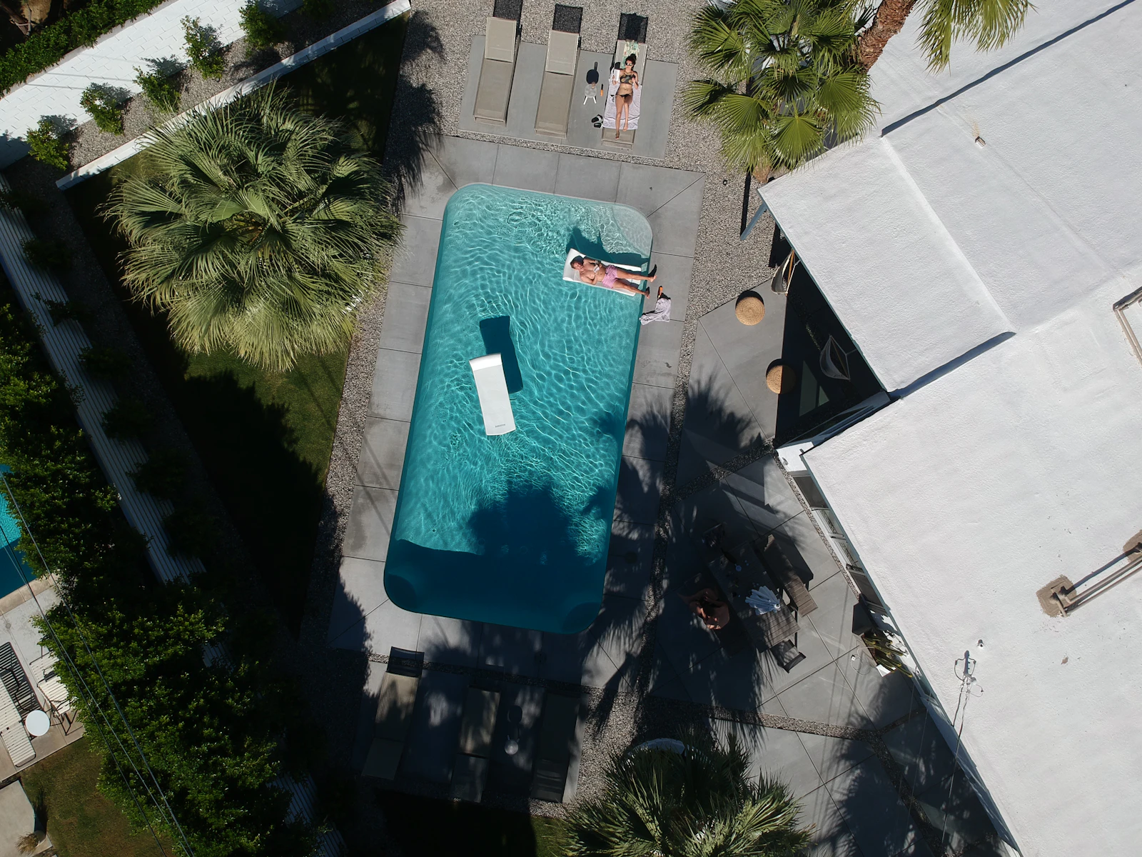 Pool with umbrella and chairs